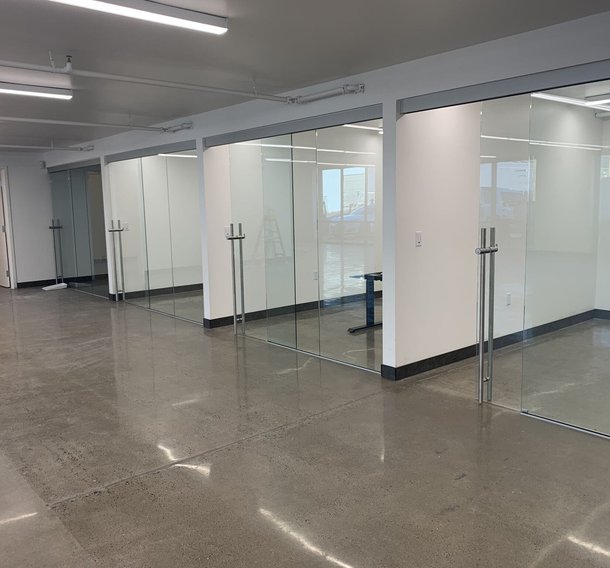 Polished concrete floor in an office suite with glass walls